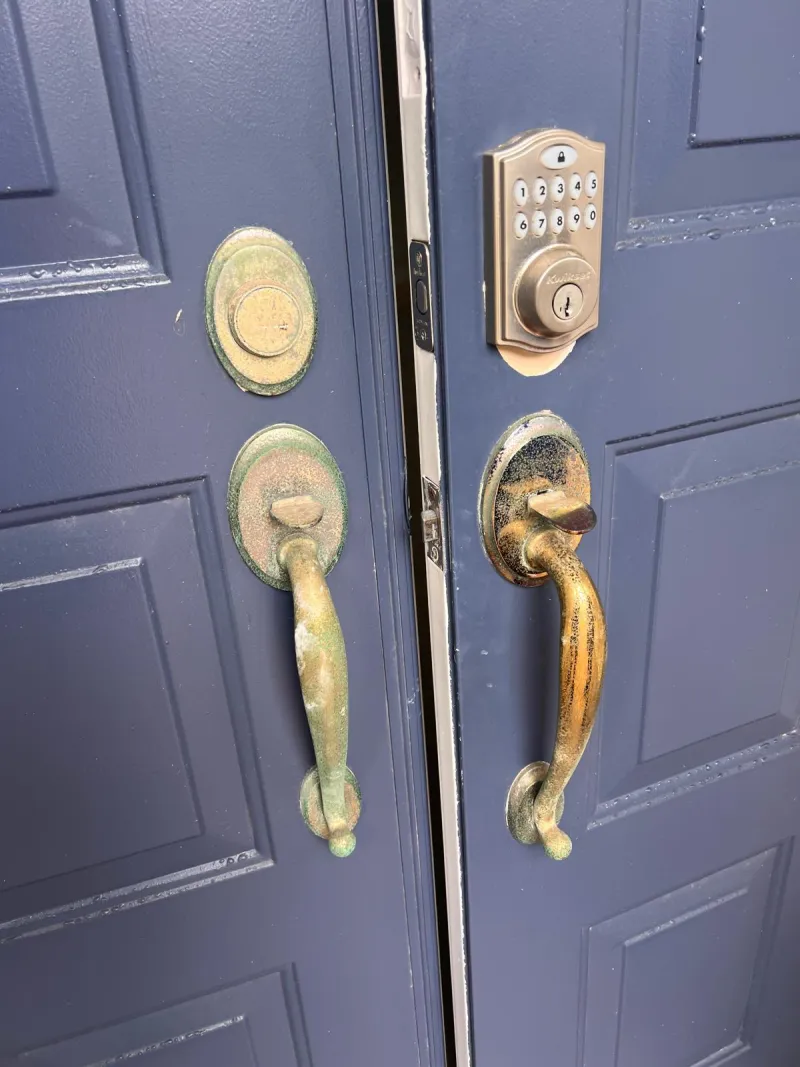 Locksmith performing emergency lock change on front door in Stuart FL