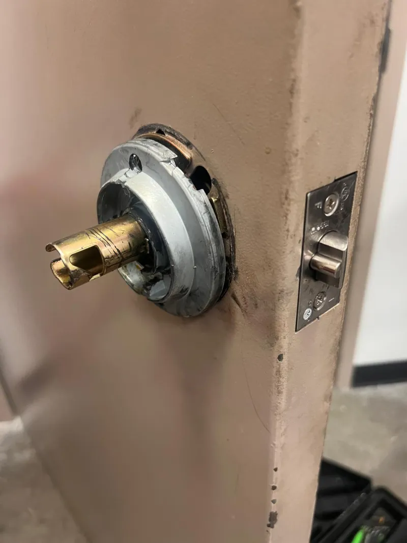Locksmith unlocking residential front door during house lockout in Stuart FL