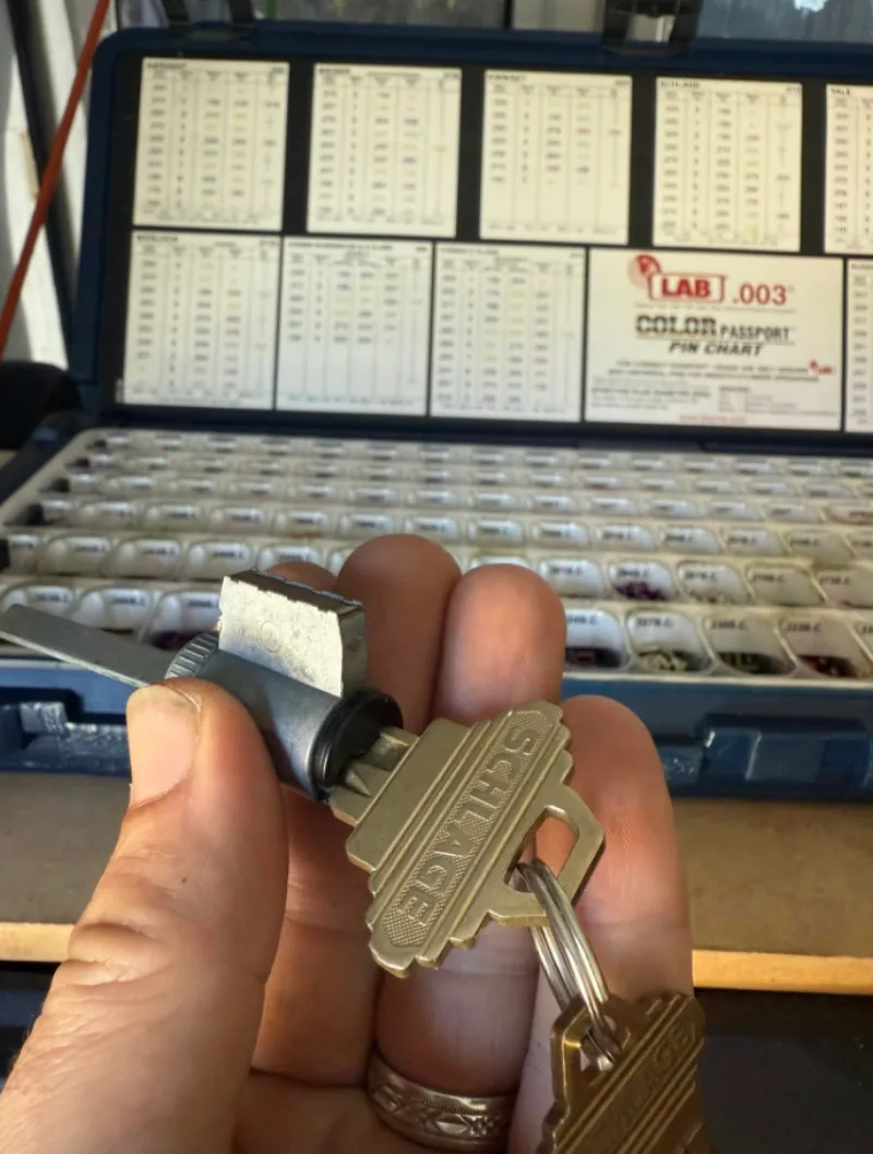 Locksmith rekeying a front door lock in Stuart FL