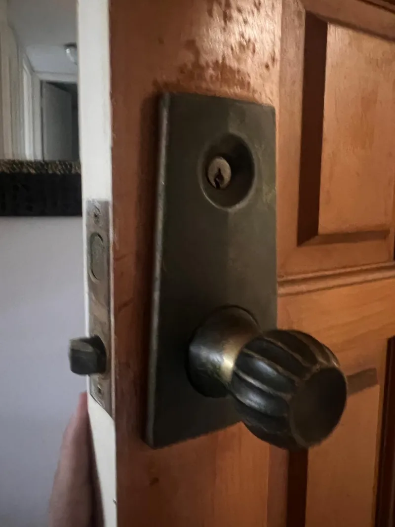 Lock repair service in Stuart FL, technician fixing door lock