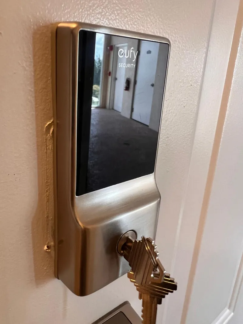 Locksmith installing high security deadbolt on residential door in Stuart FL