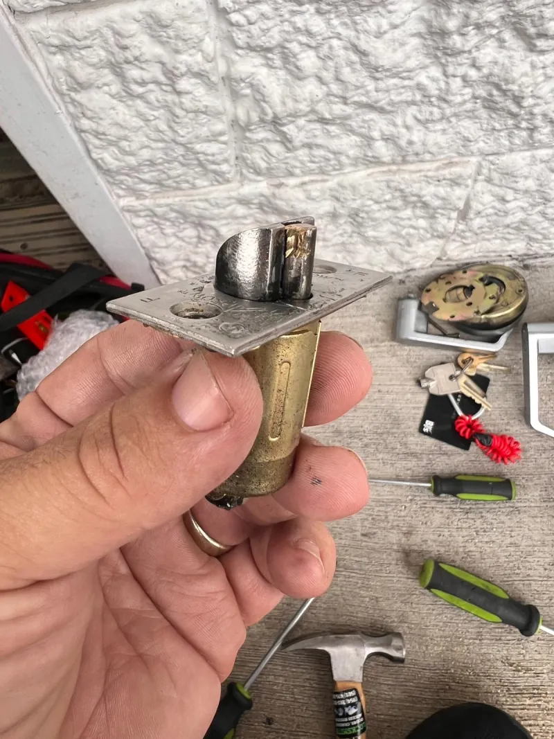 Stuart Locksmiths technician installing commercial grade 1 lock on office door