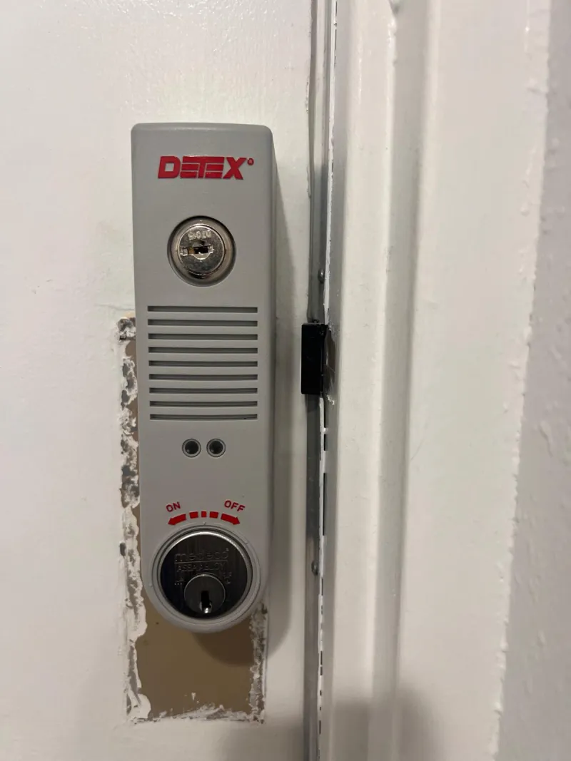 locksmith installing panic bar exit device on commercial door Stuart FL
