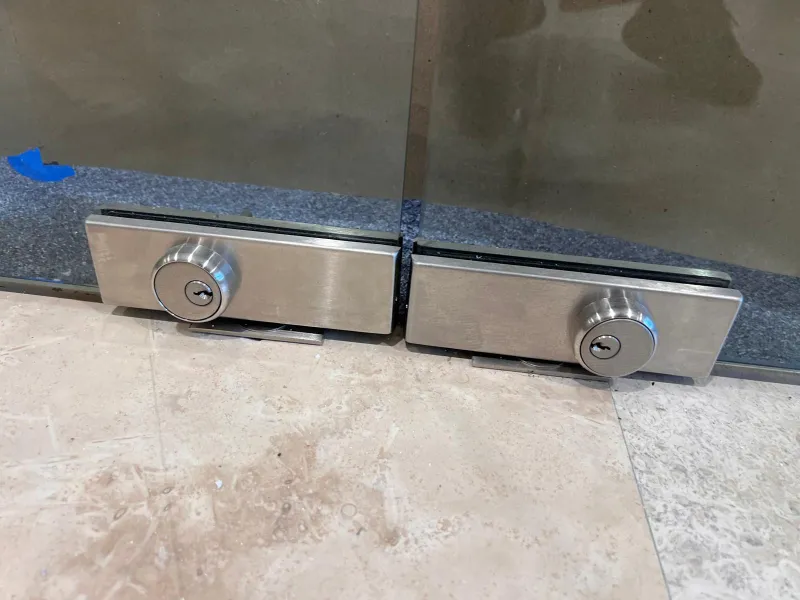 corroded storefront door lock mechanism from salt air humidity in Stuart Florida