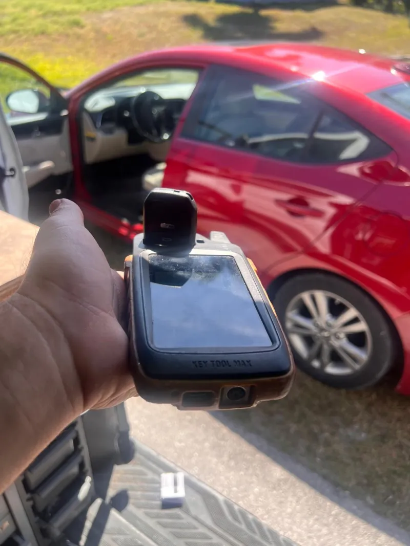 Stuart Locksmiths automotive technician with BMW vehicle in Stuart FL