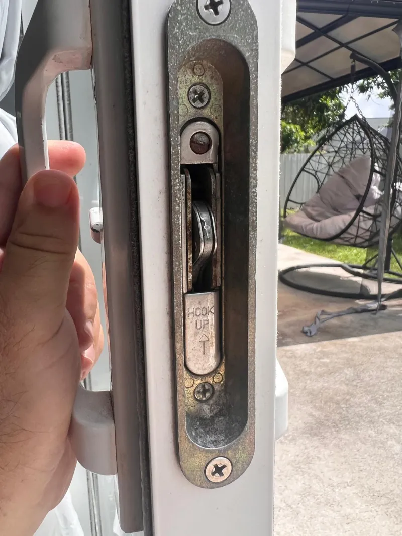 Stuart Locksmiths technician servicing garage door lock in Stuart FL
